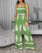 Green vintage floral square neck, backless, wide leg jumpsuit from LA FINE FLEUR.