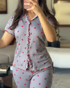 Light purple short-sleeve pajama set with red polka dots and a stand collar tee.