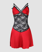 Red satin babydoll with black lace accents, floral lace bust, crisscross straps.