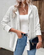 Long sleeve ribbed button-front hoodie with asymmetrical hem coat over white tank and jeans.