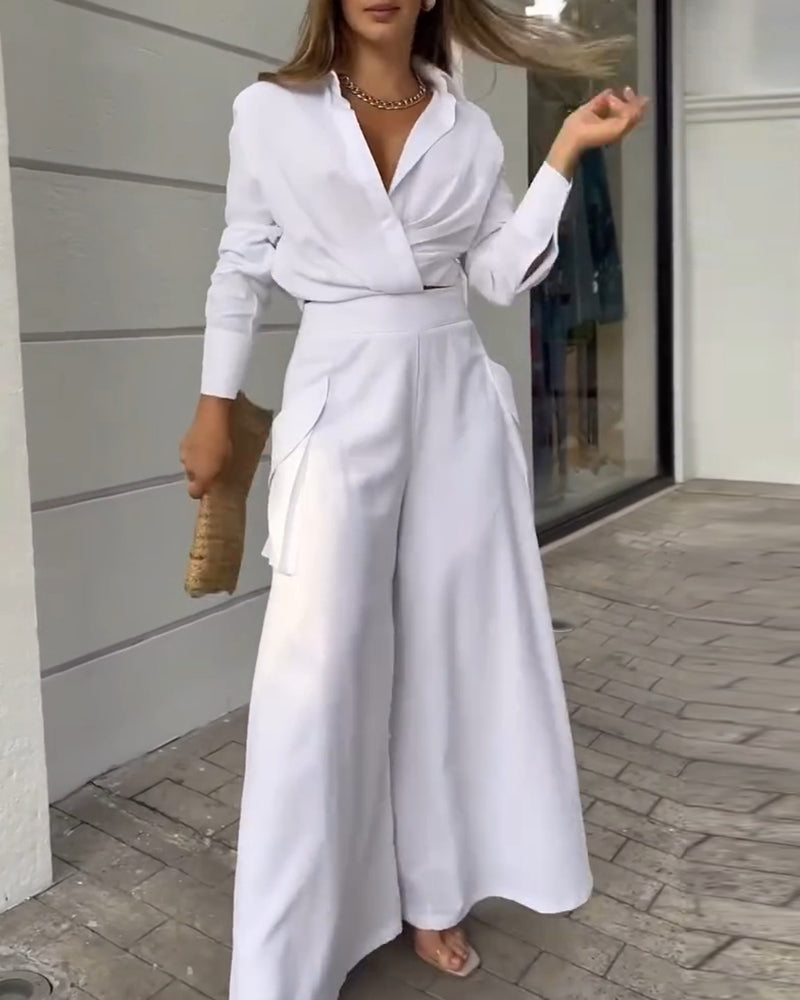 LA FINE FLEUR  2-piece set featuring a ruched crop top and matching wide-leg pants.