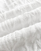 Textured white bomber jacket with wavy jacquard diamond pattern and subtle hollow-out design.