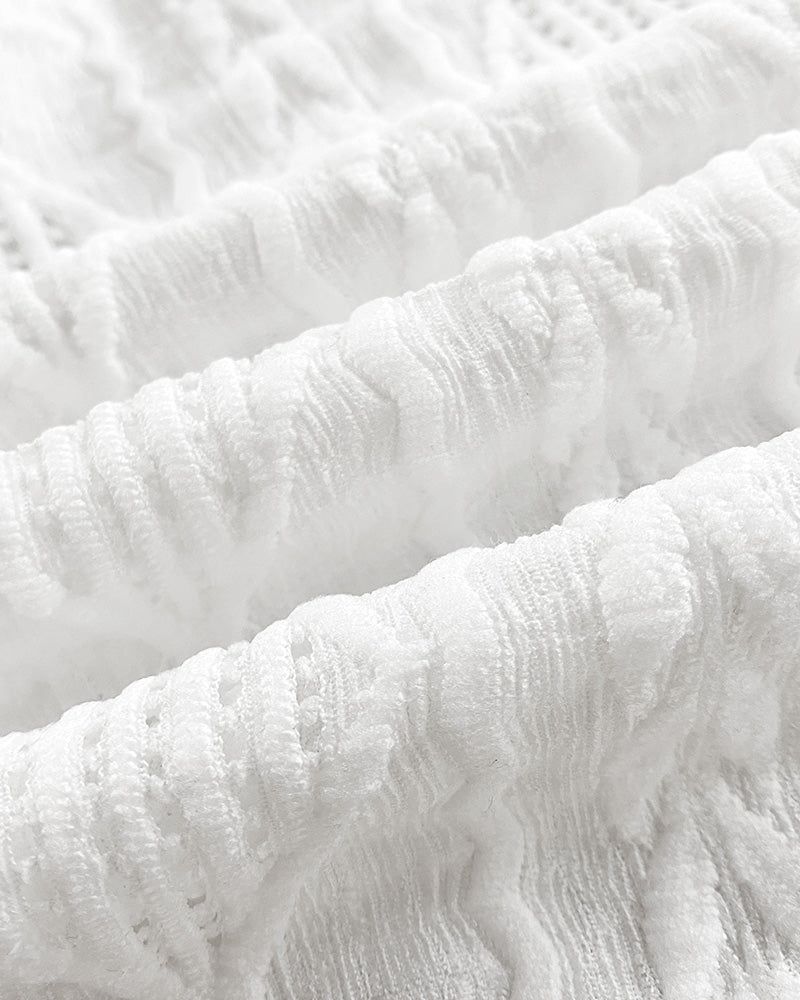 Textured white bomber jacket with wavy jacquard diamond pattern and subtle hollow-out design.
