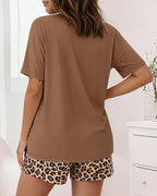 LA FINE FLEUR Bowknot Top paired with matching leopard print shorts pajama set.