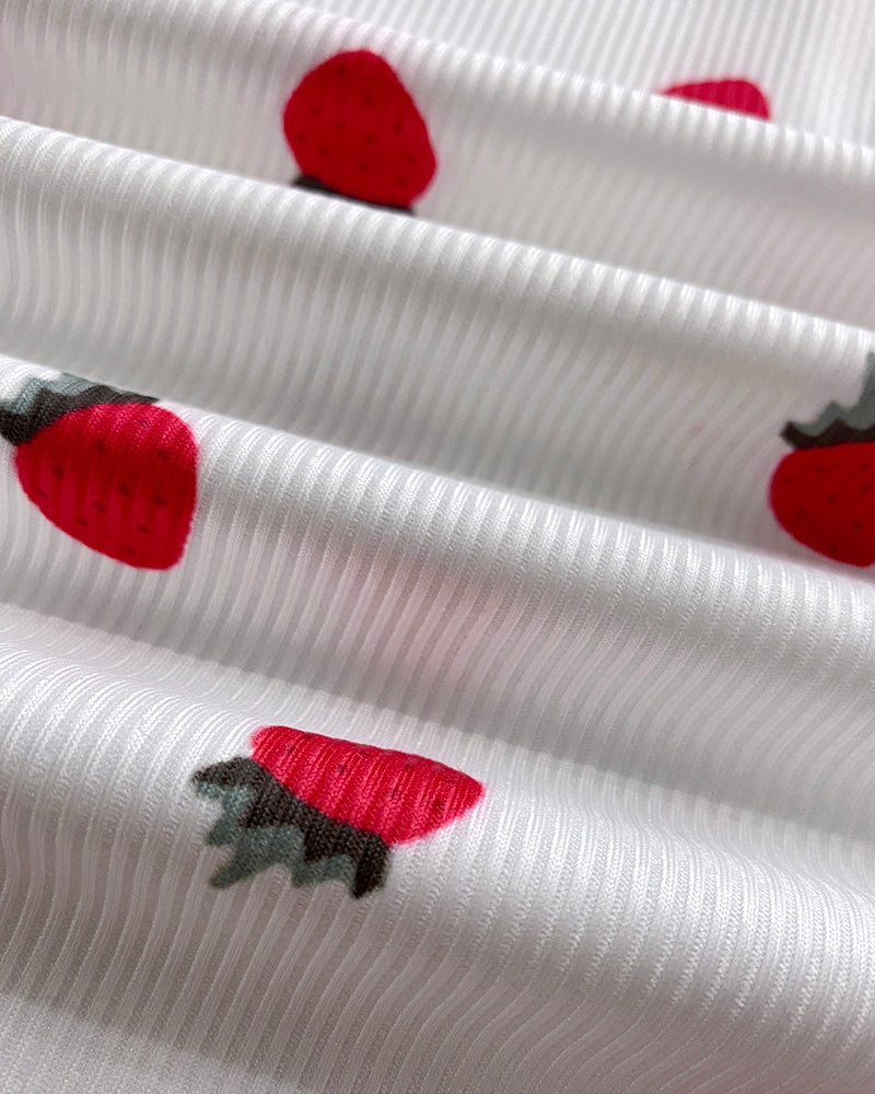 White textured pajama set with red strawberry and green leaf print, stand collar tee.