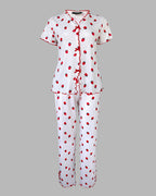 A strawberry print pajama set with stand collar tee, short sleeves, long pants, red ruffle trim.