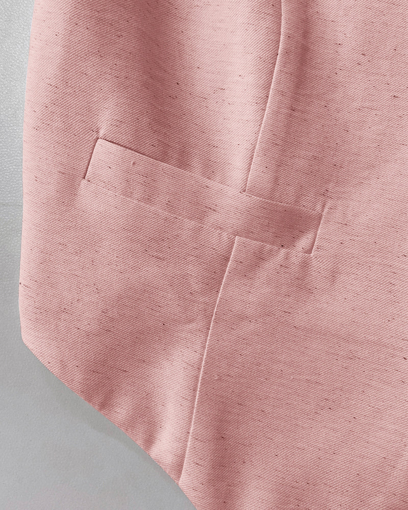 Light pink LA FINE FLEUR blazer with welt pocket and visible tailored stitching detail.