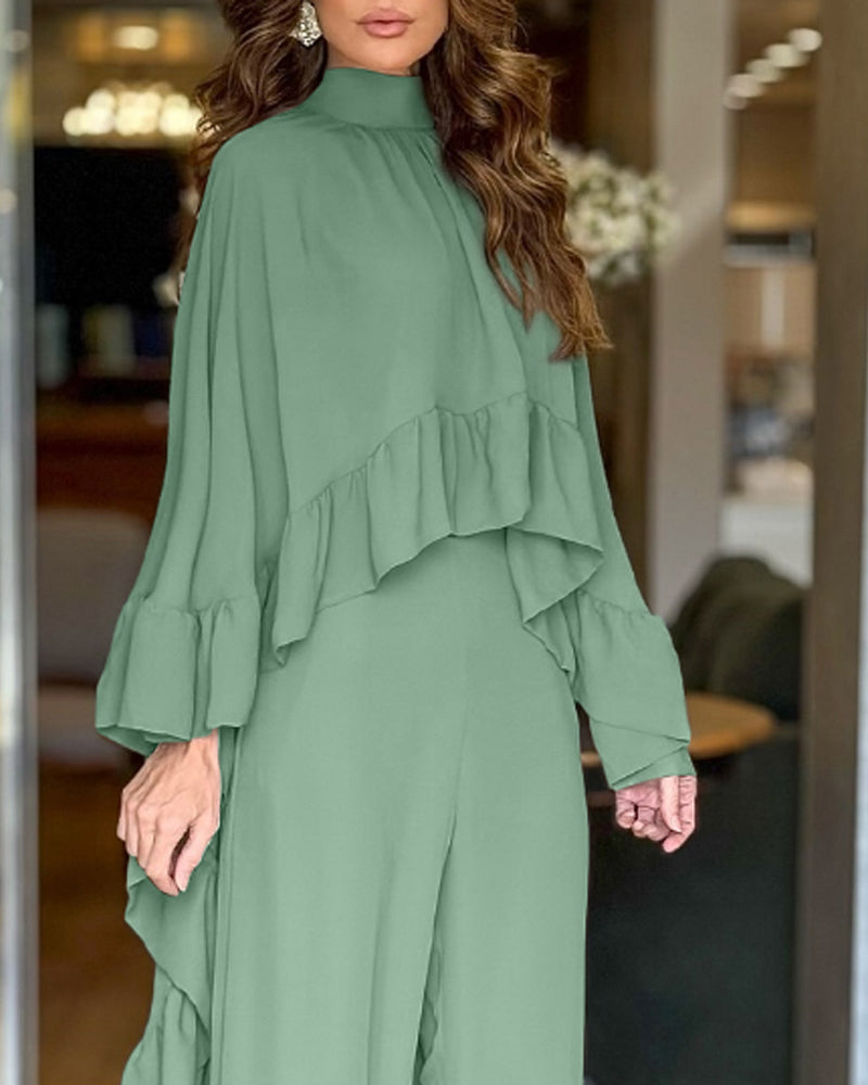 The LA FINE FLEUR  2-piece high neck cape with ruffles and wide-leg pants set.