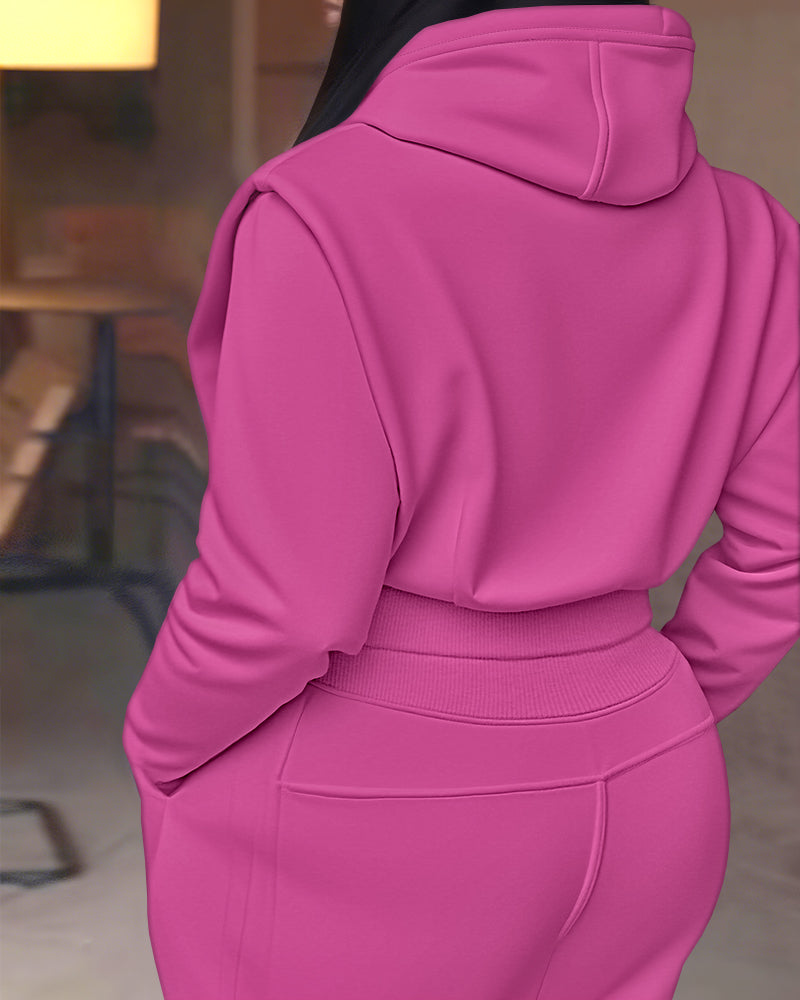 Bright pink 2-piece long sleeve hoodie with thumbholes and matching wide-leg pants set.