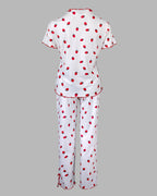 Short-sleeve stand collar tee and long pants pajama set with strawberry print and red ruffled trim.