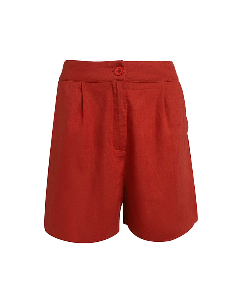 High-waisted red linen shorts with pleats, a button and zip closure, matching wrap top.