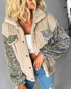 LA FINE FLEUR Turn-Down Collar Teddy Jacket with Sequin Patch, white crop top, blue ripped jeans.
