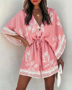 Floral V-Neck Mini Dress with bell sleeves and a drawstring waist by LA FINE FLEUR.