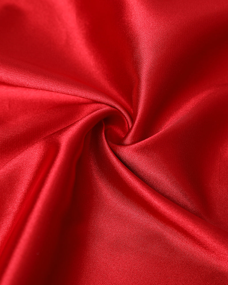 Red satin babydoll dress featuring lace and crisscross details, with a glossy sheen.