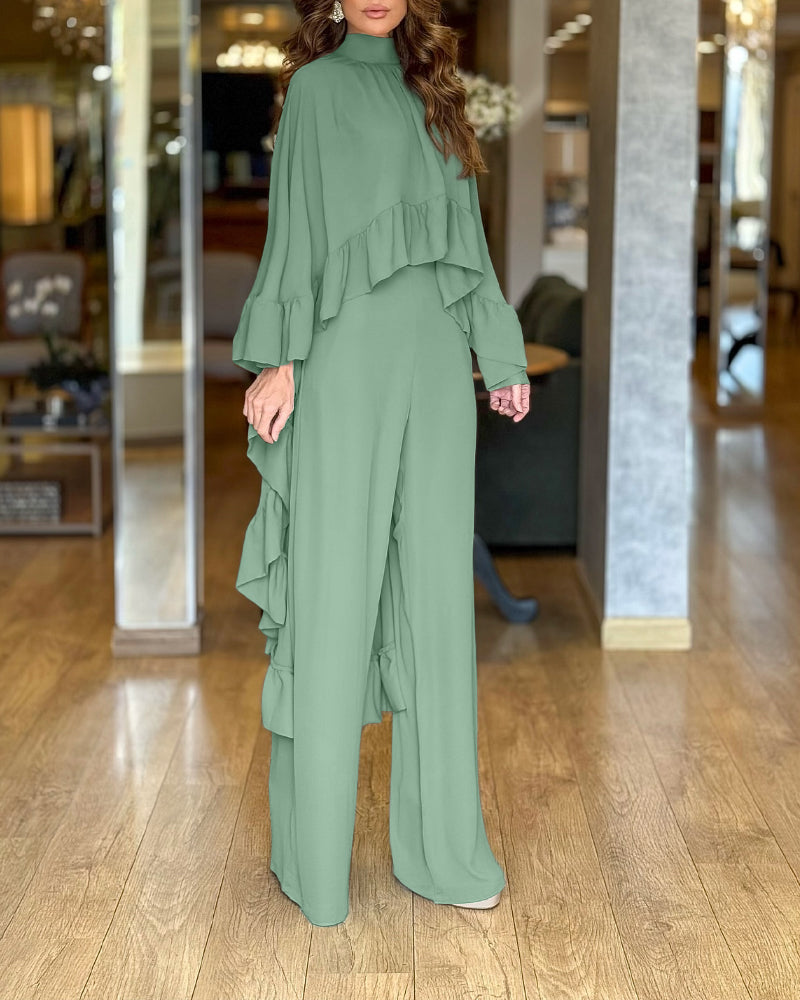 A 2-piece set featuring a high neck cape with ruffles and wide-leg pants.