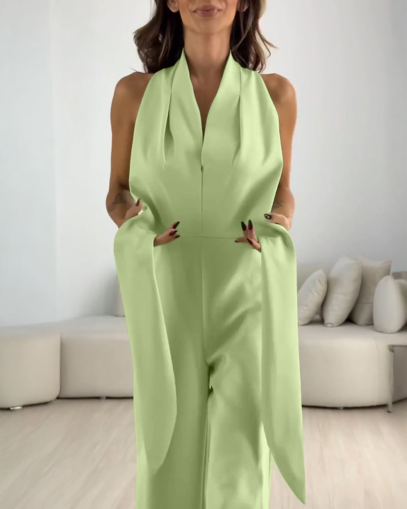 A halter sleeveless, ruched, zip-back tie-waist wide-leg jumpsuit by LA FINE FLEUR.