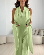 A halter sleeveless, ruched, zip-back tie-waist wide-leg jumpsuit by LA FINE FLEUR.