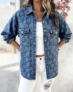 LA FINE FLEUR  Vintage Heart Jacquard Denim Jacket with Asymmetrical Hem, white ribbed top, ripped jeans.