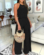 A 2-piece halter top and slit pants set featuring elegant Guipure lace details.