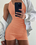Peach micro-ribbed U-neck tank and boxer lounge set, partially covered by a light gray hoodie.