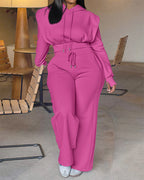 Vibrant pink long sleeve hoodie with thumbholes and matching wide-leg pants set.