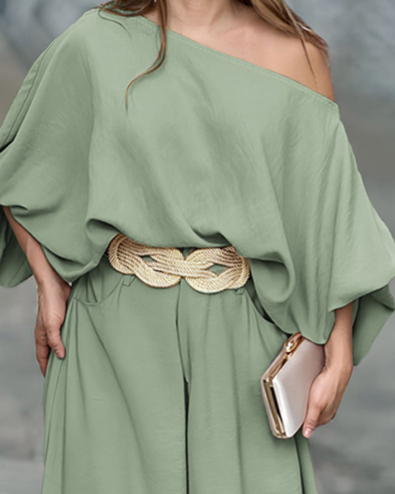 Sage green LA FINE FLEUR skew neck lantern sleeve blouse with matching wide leg pants.