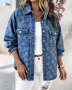 Vintage Heart Jacquard Denim Jacket with asymmetrical hem over white ribbed top and distressed jeans.