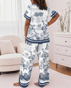 2-piece pajama set featuring animal and plant prints, viewed from the back.