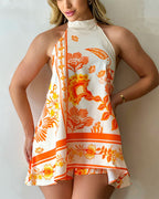 Floral print halter backless skorts romper with tie sleeves, stripe hem, A-line silhouette.
