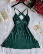 A dark green V-Neck lace babydoll with criss-cross side slit and delicate detailing.