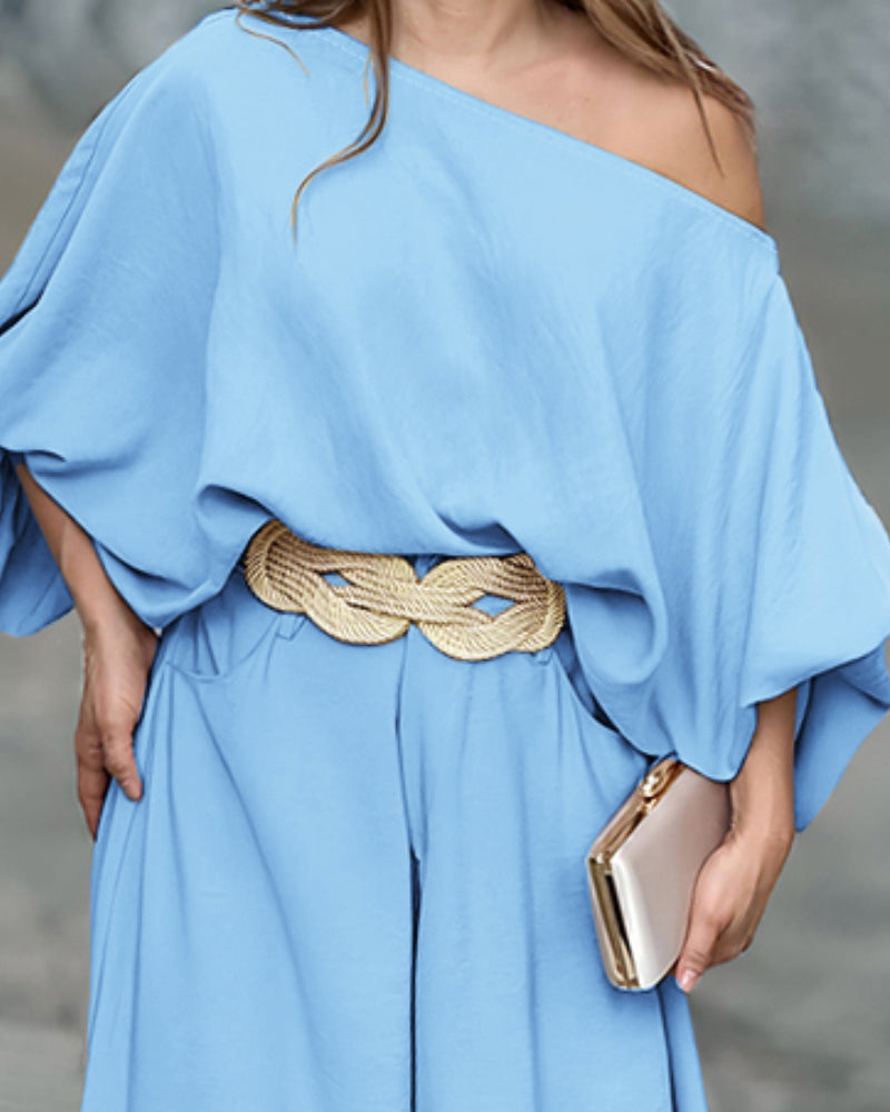 LA FINE FLEUR Skew Neck Lantern Sleeve Blouse and Wide Leg Pants Set in matching fabric.