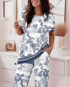 A 2-piece pajama set with animal and plant prints from LA FINE FLEUR.