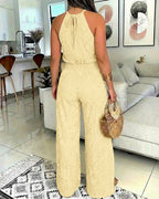 A 2-piece halter top and slit pants set with intricate guipure lace detailing.