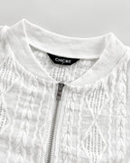 Lightweight bomber jacket with ribbed collar, silver zipper, and diamond wavy jacquard fabric.