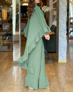 Sage green high-neck cape with ruffles paired with wide-leg pants, two-piece set.