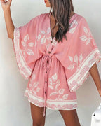 LA FINE FLEUR Floral V-Neck Mini Dress with bell sleeves, drawstring waist, and white leaf patterns.