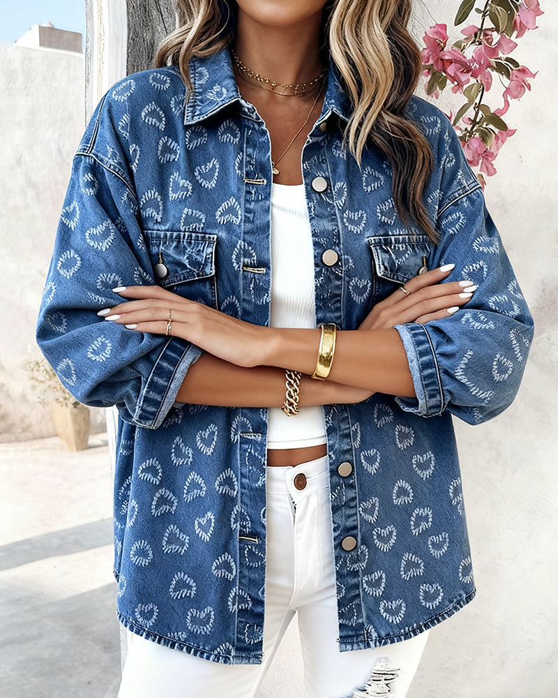 LA FINE FLEUR  Vintage Heart Jacquard Denim Jacket with asymmetrical hem over white crop top and pants.