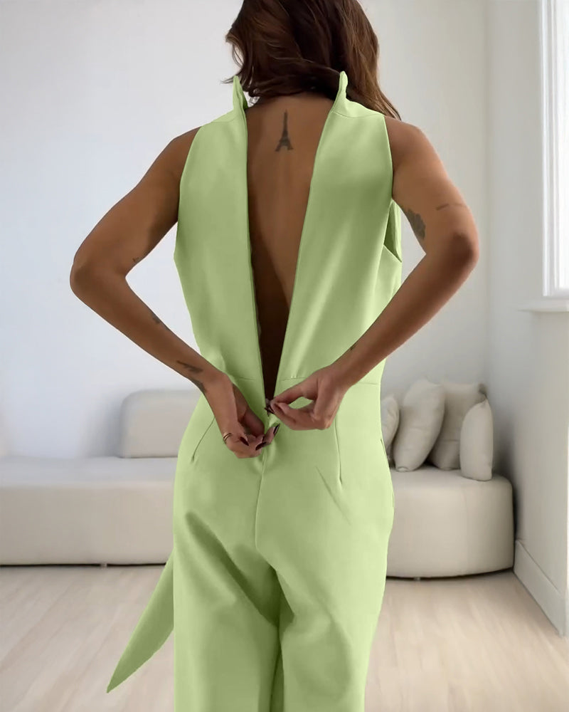 Light green halter sleeveless ruched zip-back tie-waist wide-leg jumpsuit.
