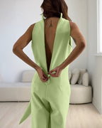 Light green halter sleeveless ruched zip-back tie-waist wide-leg jumpsuit.