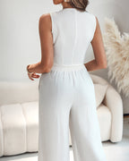 A V-neck vest crop top paired with wide-leg pants from the LA FINE FLEUR collection.