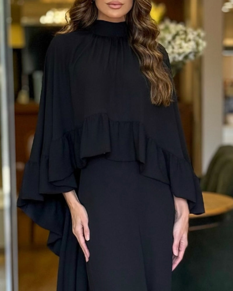 Black 2-piece high neck cape with ruffles and matching wide-leg pants.