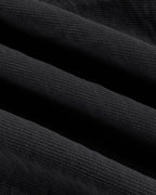 Close-up of blouse and wide leg pants set fabric, rich black texture and woven detail.