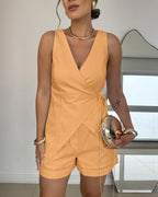 Peach LA FINE FLEUR 2-piece linen wrap top and pocketed shorts set.
