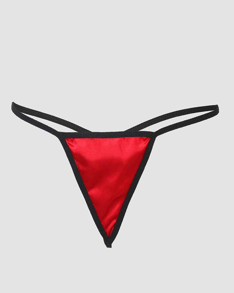 Red satin thong with black trim and thin side straps paired with lace crisscross babydoll.