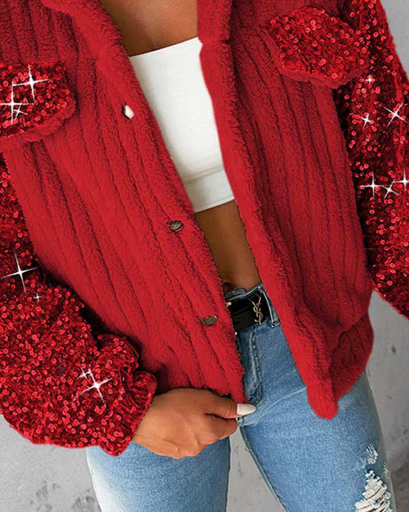 Red LA FINE FLEUR teddy jacket with sequin patch, white crop top, blue ripped jeans.