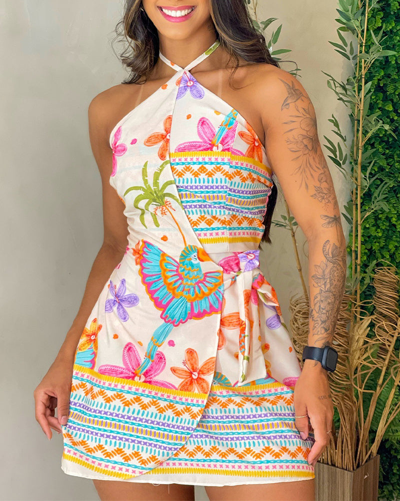 A tropical print halter backless romper with tie-back and wrap skorts, butterfly patterns.