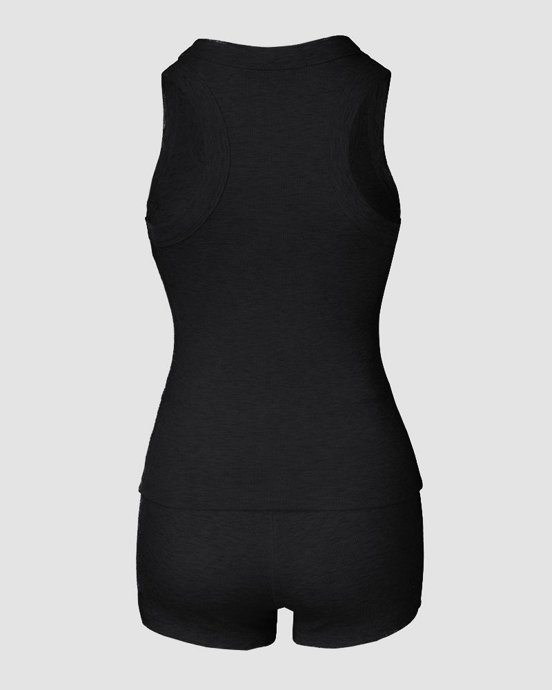 Black micro-ribbed sleeveless tank top and matching boxer shorts lounge set, no logos.