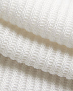 White ribbed knit hoodie with horizontal textured lines and asymmetrical hem, button-front design.