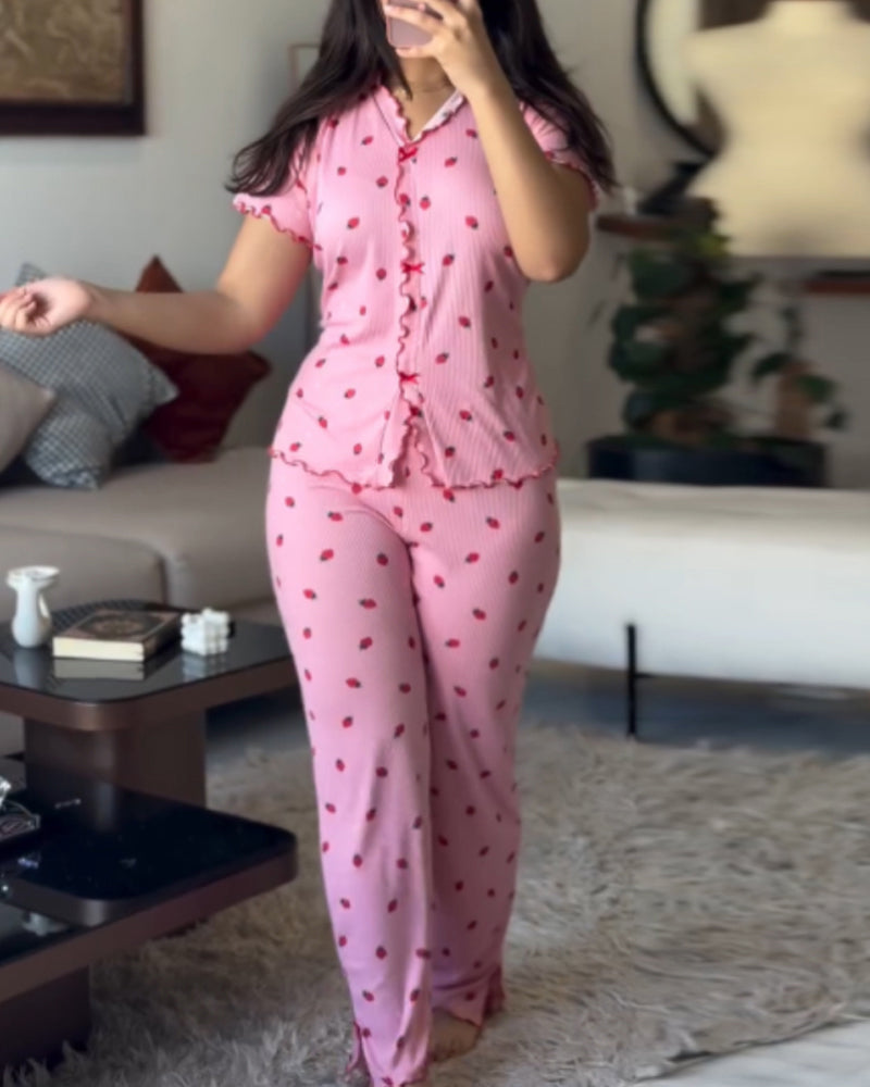 LA FINE FLEUR strawberry print pajama set with a stand collar tee and matching pants.
