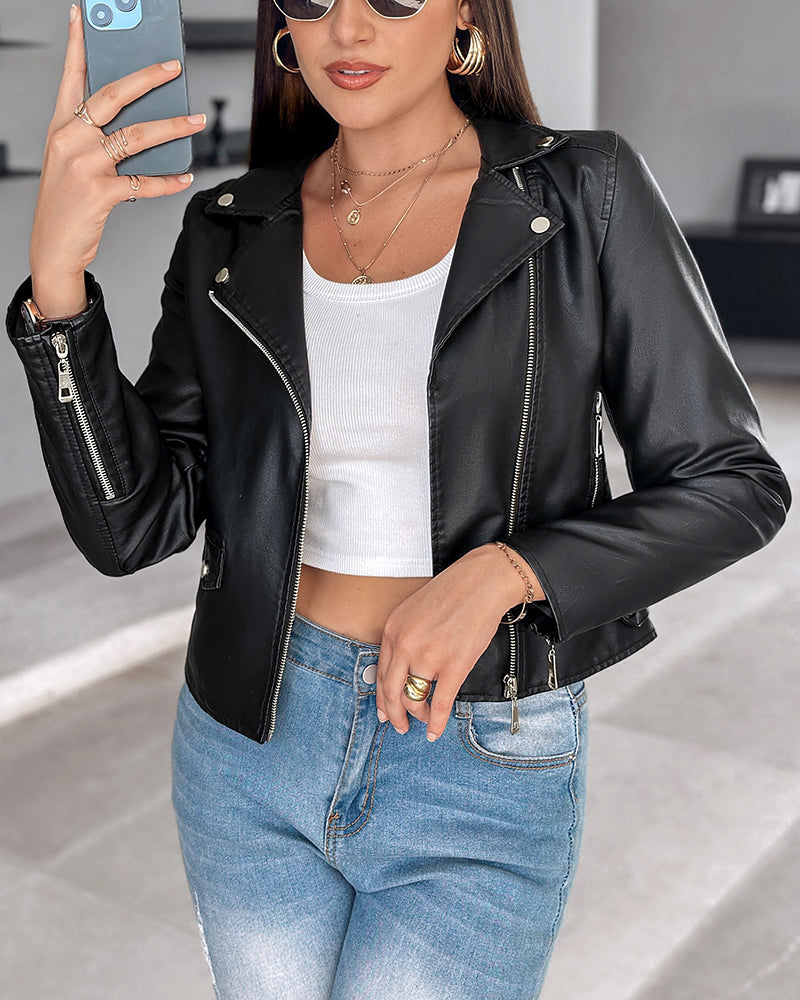 LA FINE FLEUR  PU leather zipper biker jacket, white crop top, light blue jeans.